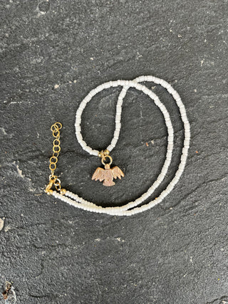 Solana Beaded Charm Necklace- White + Bronze Bird (18")